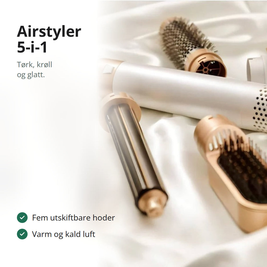 Airstyler med fem utskiftbare hoder på en silkeduk