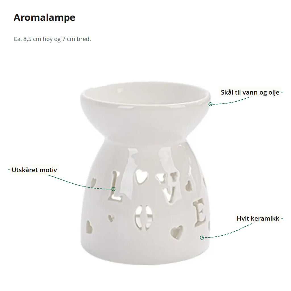 Aromalampe i hvit keramikk merket med skål til vann og olje, utskåret motiv og hvit keramikk