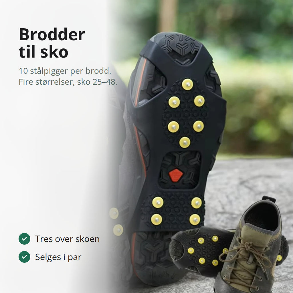 Brodder med gule stålpigger tredd over et par fjellsko