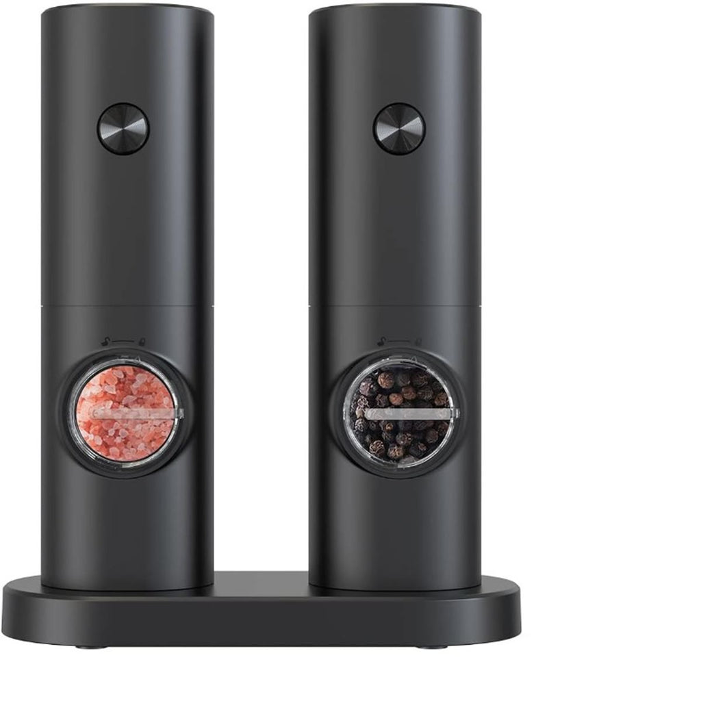 To elektriske kverner med salt og pepper på et felles ladestativ
