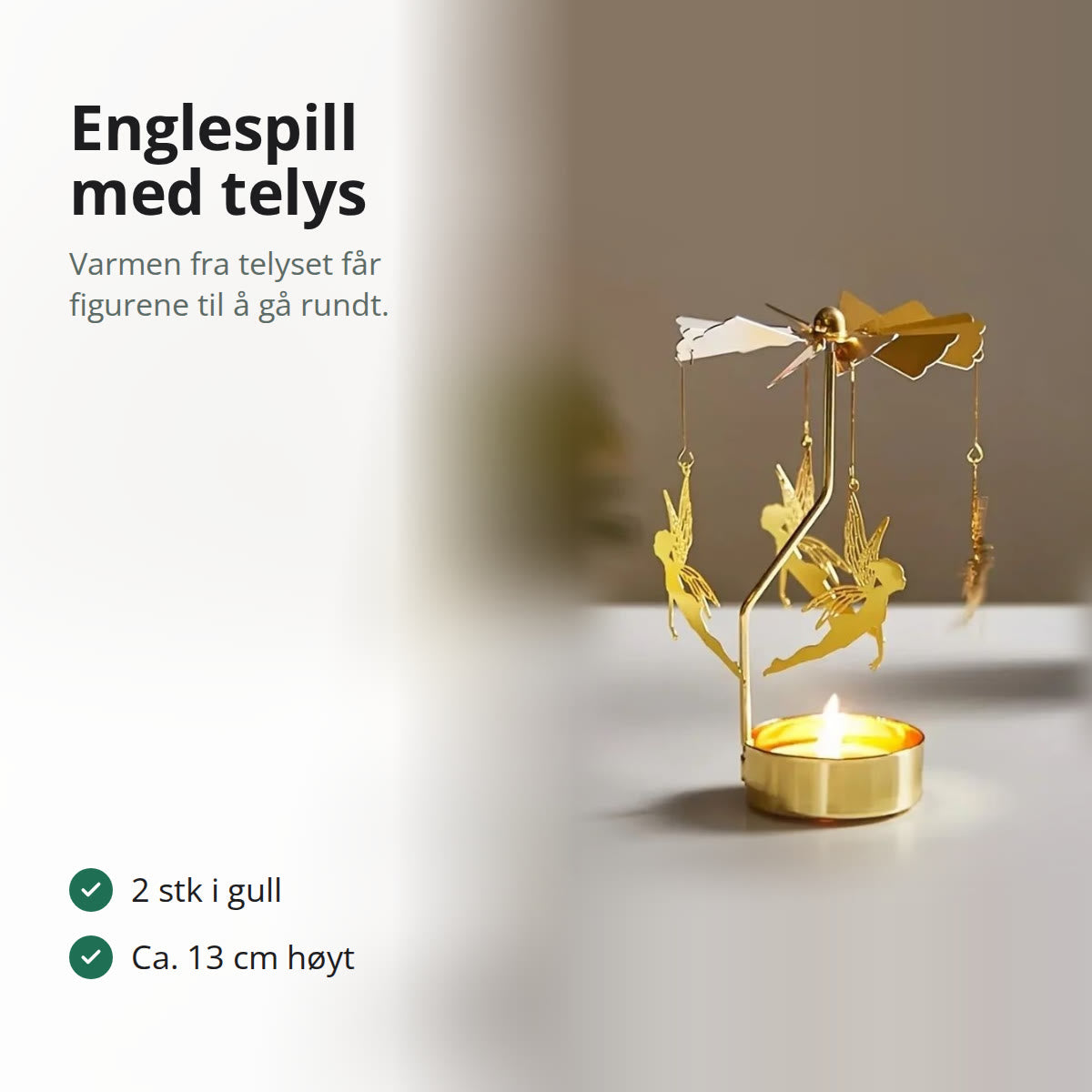 Englespill i gull med fire engler under propellen og et tent telys i koppen