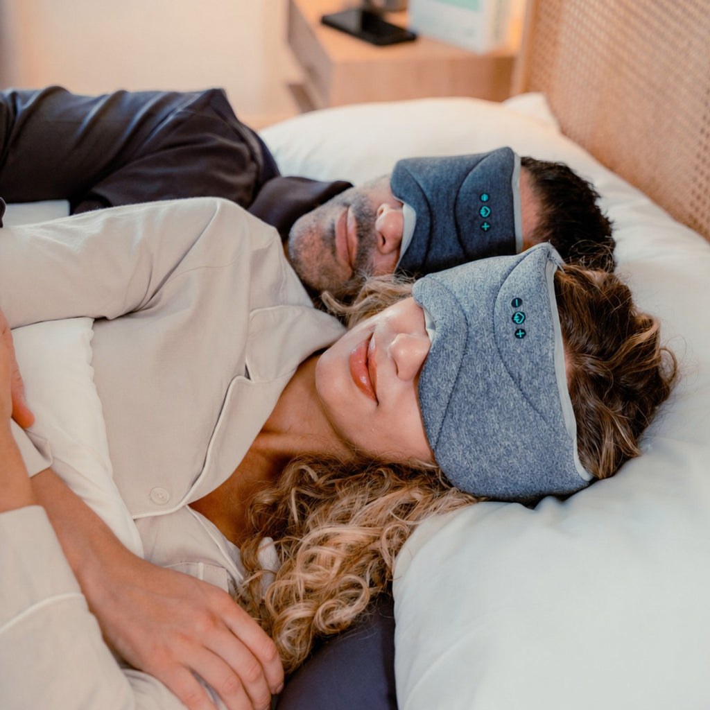 To personer sover med masken paa