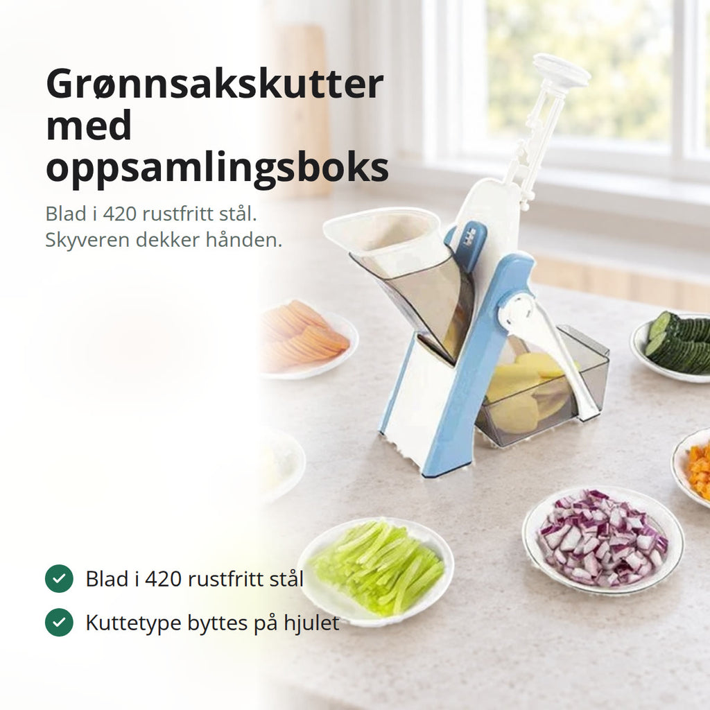 Grønnsakskutter i grått og hvitt med gjennomsiktig oppsamlingsboks, på en kjøkkenbenk