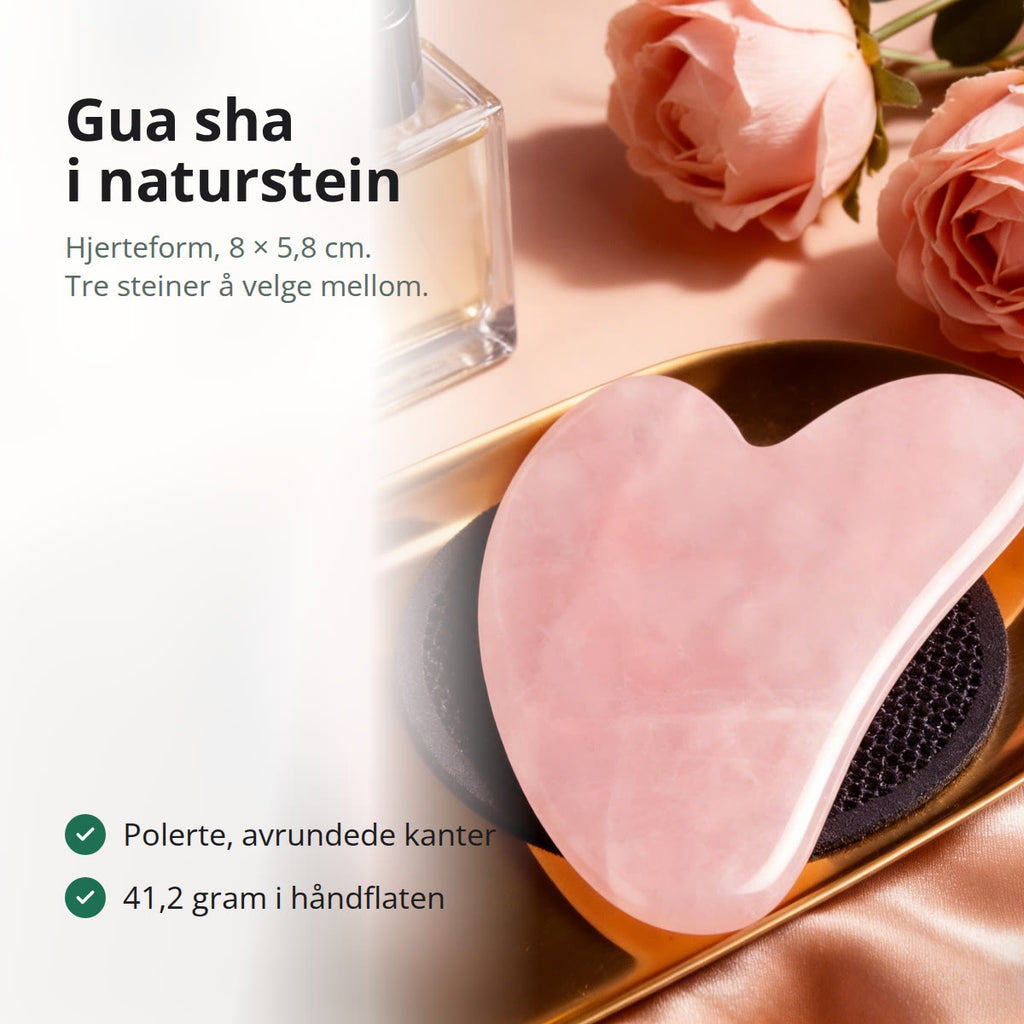 Hjerteformet gua sha i rosa naturstein med polerte, avrundede kanter