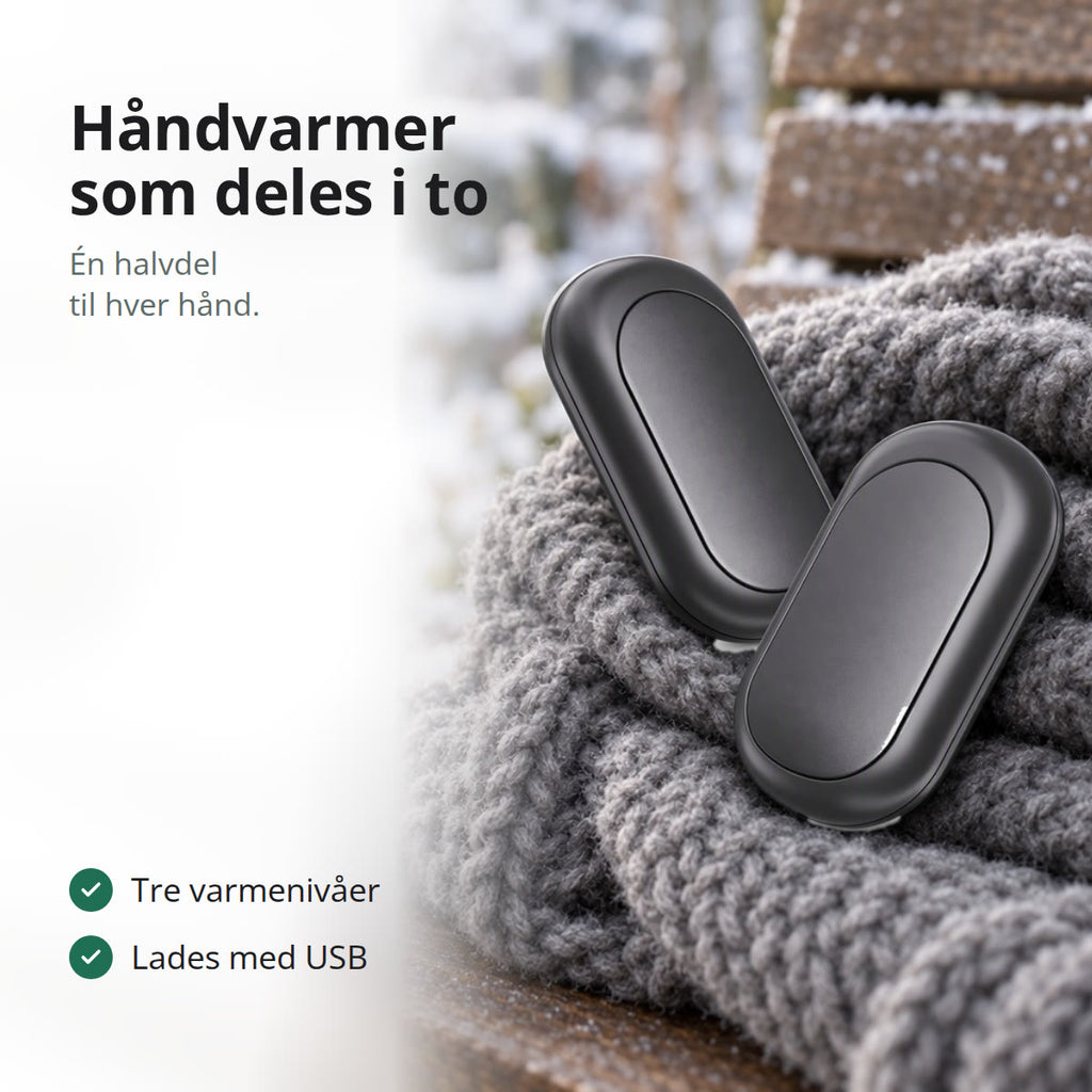 Svart oppladbar håndvarmer i to halvdeler på et ullskjerf på en benk i snøen