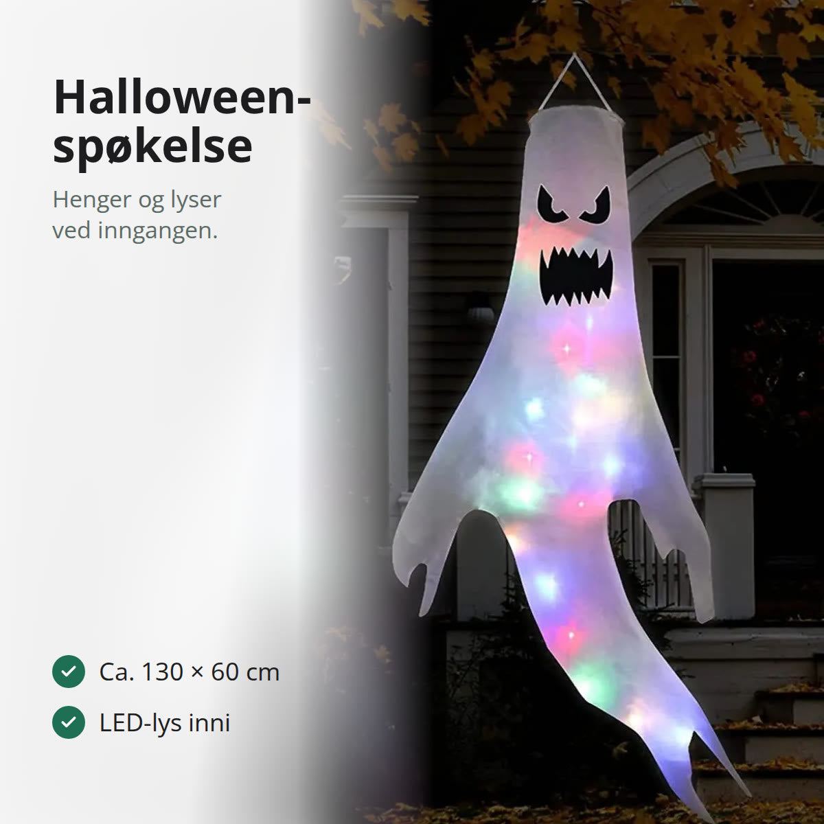 Tent hengende halloween spøkelse med sint ansikt og fargerike LED-lys foran et hus om kvelden