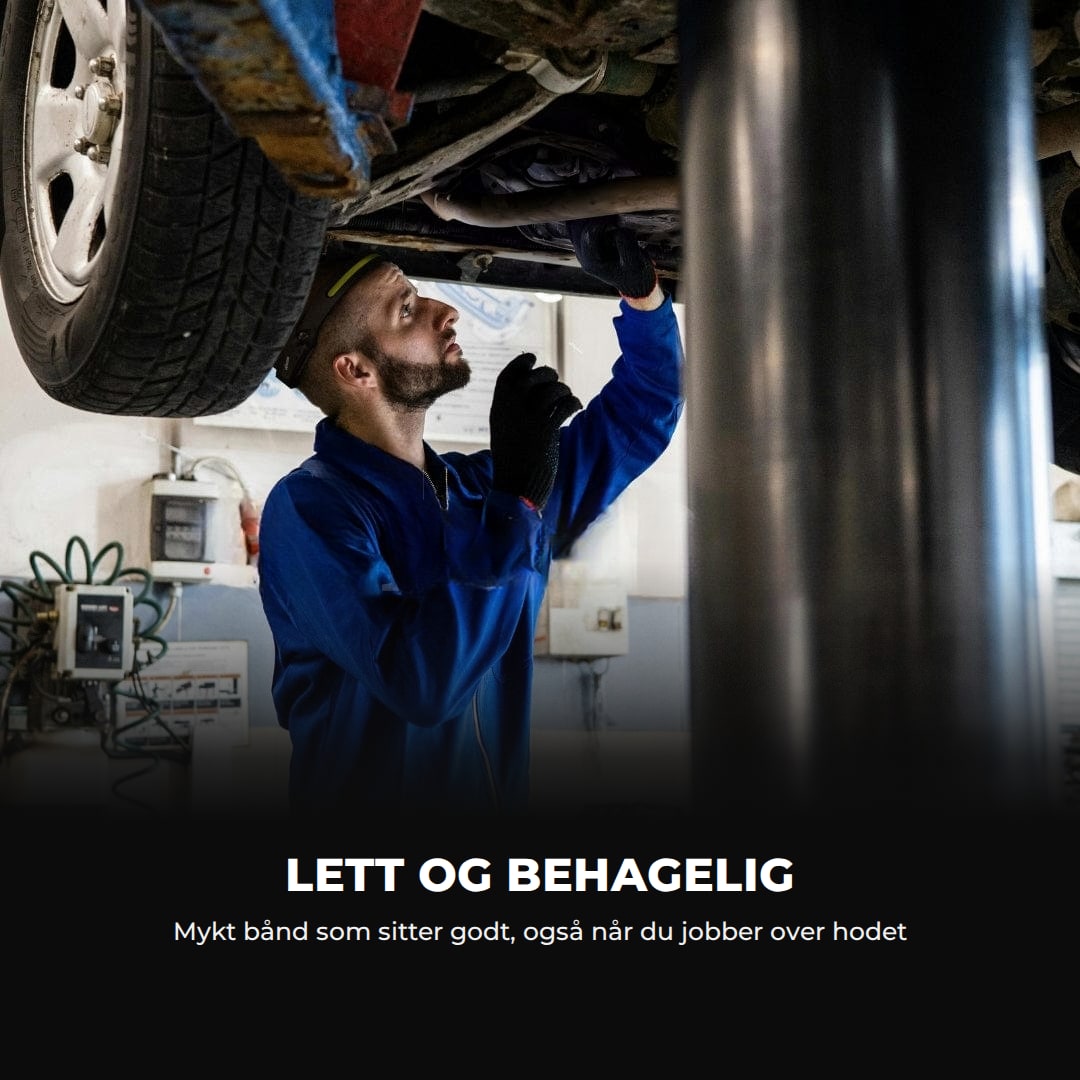 Mekaniker under en bil med hodelykten: lett og behagelig bånd