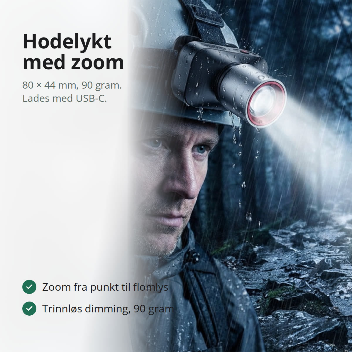 Sort hodelykt med teleskopisk zoomhode i aluminium, liggende på et værbitt trebord