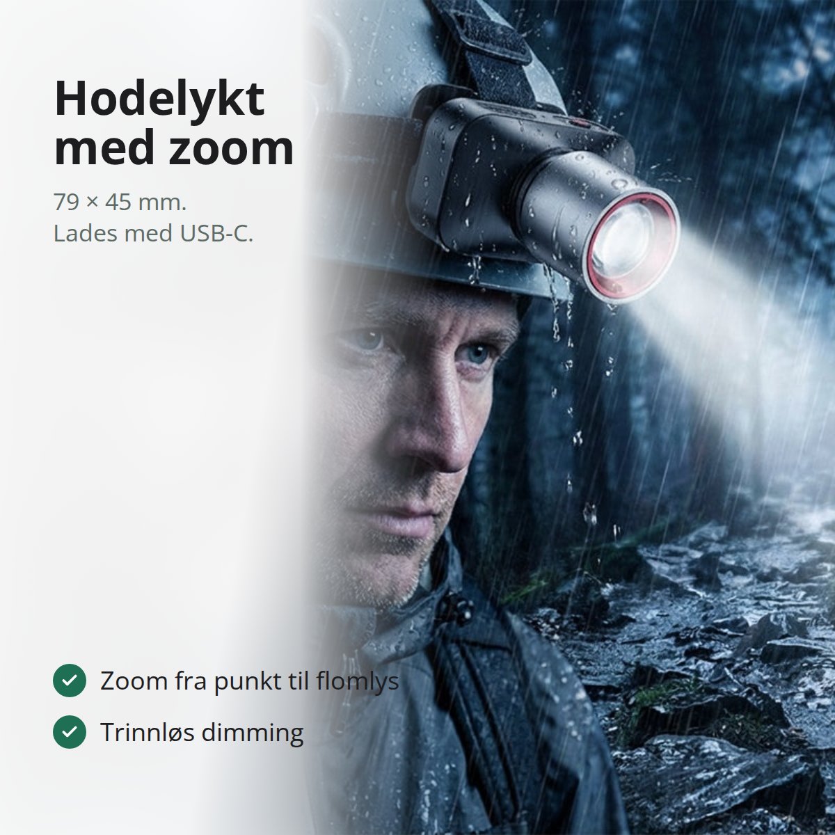 Sort hodelykt med teleskopisk zoomhode i aluminium, liggende på et værbitt trebord