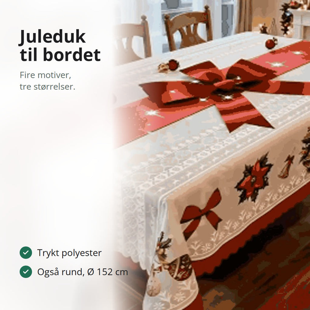 Juleduk med rød sløyfe og bånd på et dekket spisebord