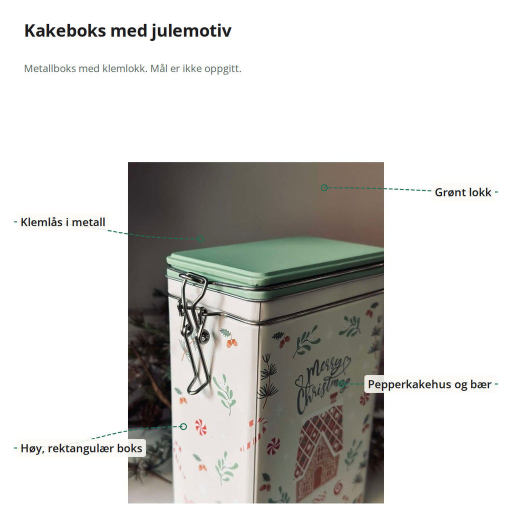 Kakeboksen merket med klemlås i metall, grønt lokk, pepperkakehus og bær, og høy rektangulær form