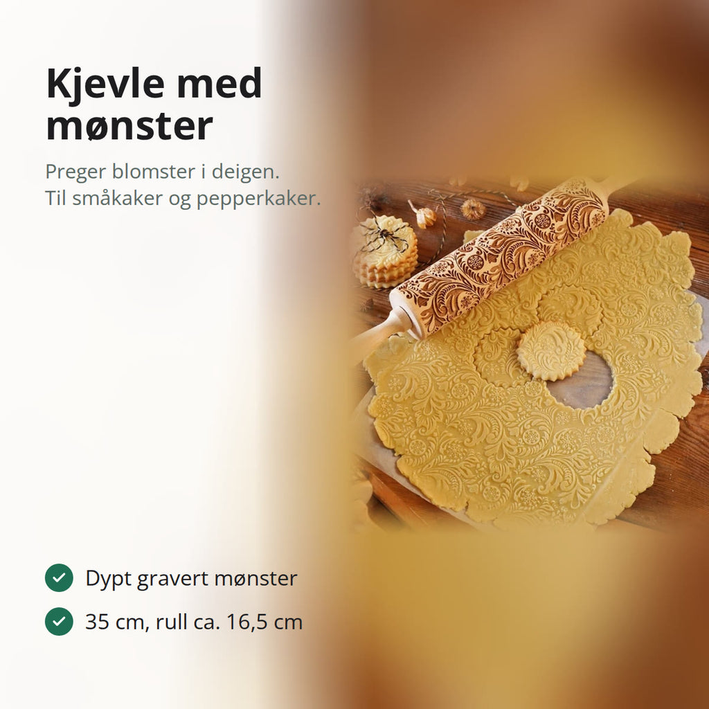 Kjevle i tre med gravert blomstermønster på utrullet kakedeig med preget mønster