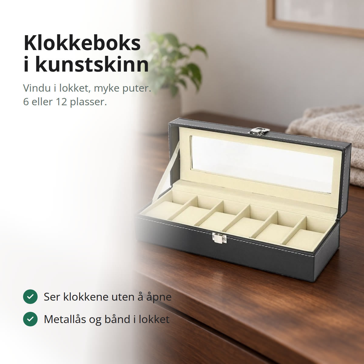 Klokkeboks i svart kunstskinn med seks puter og vindu i lokket på en kommode