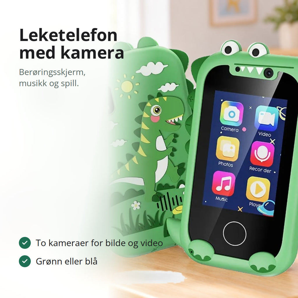 Grønn leketelefon med dinosaurdeksel på et barnebord