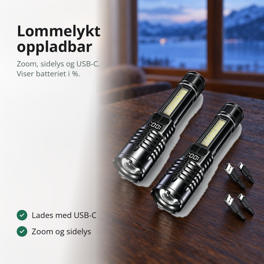 To svarte oppladbare lommelykter med ladekabler på et bord i en hytte