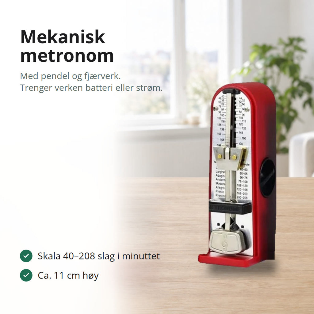 Rød mekanisk metronom med pendel og tempo-skala, stående på et bord i lys eik i en lys stue med vindu og grønn plante
