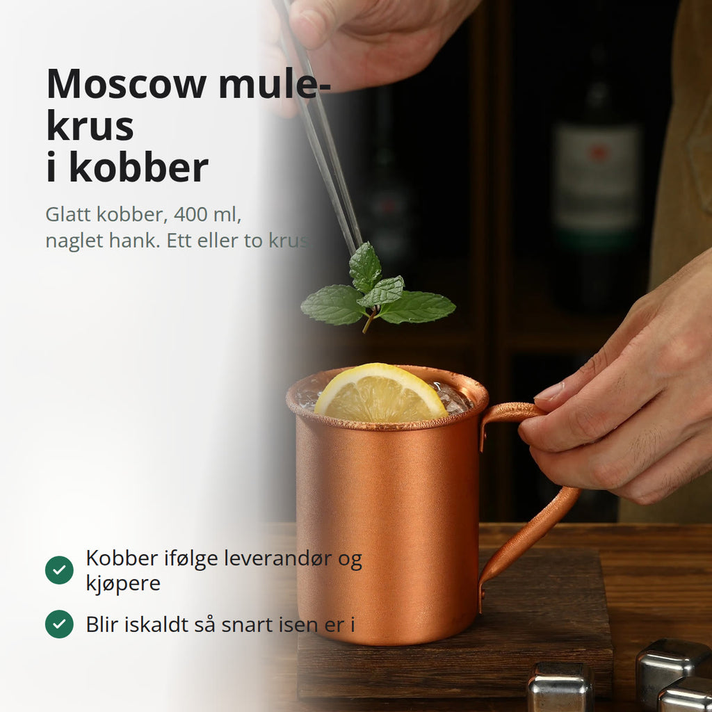 Glatt kobberkrus til moscow mule med naglet hank, fylt med is, lime og mynte, i hendene på en bartender