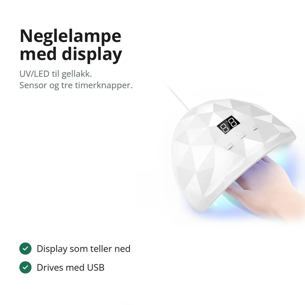 Hvit neglelampe med display over en hånd med gellakk