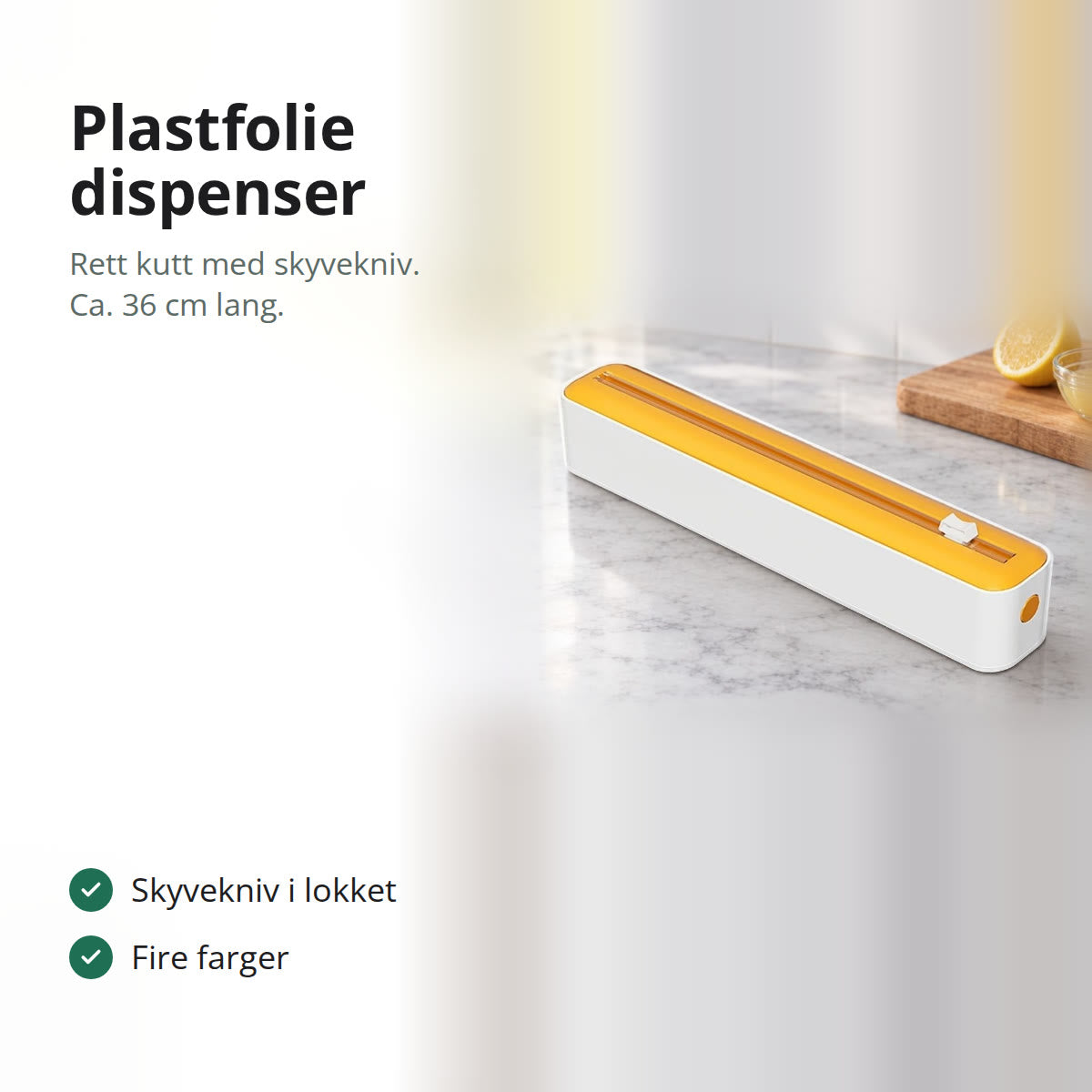 Plastfolie dispenser med gult lokk og skyvekniv på en marmorbenk i et lyst kjøkken