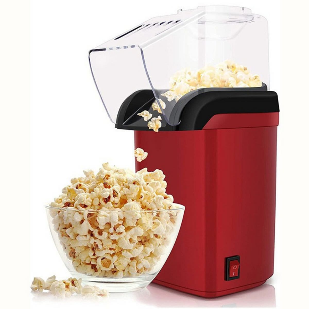 Rød popcornmaskin ved siden av en bolle med ferske popcorn