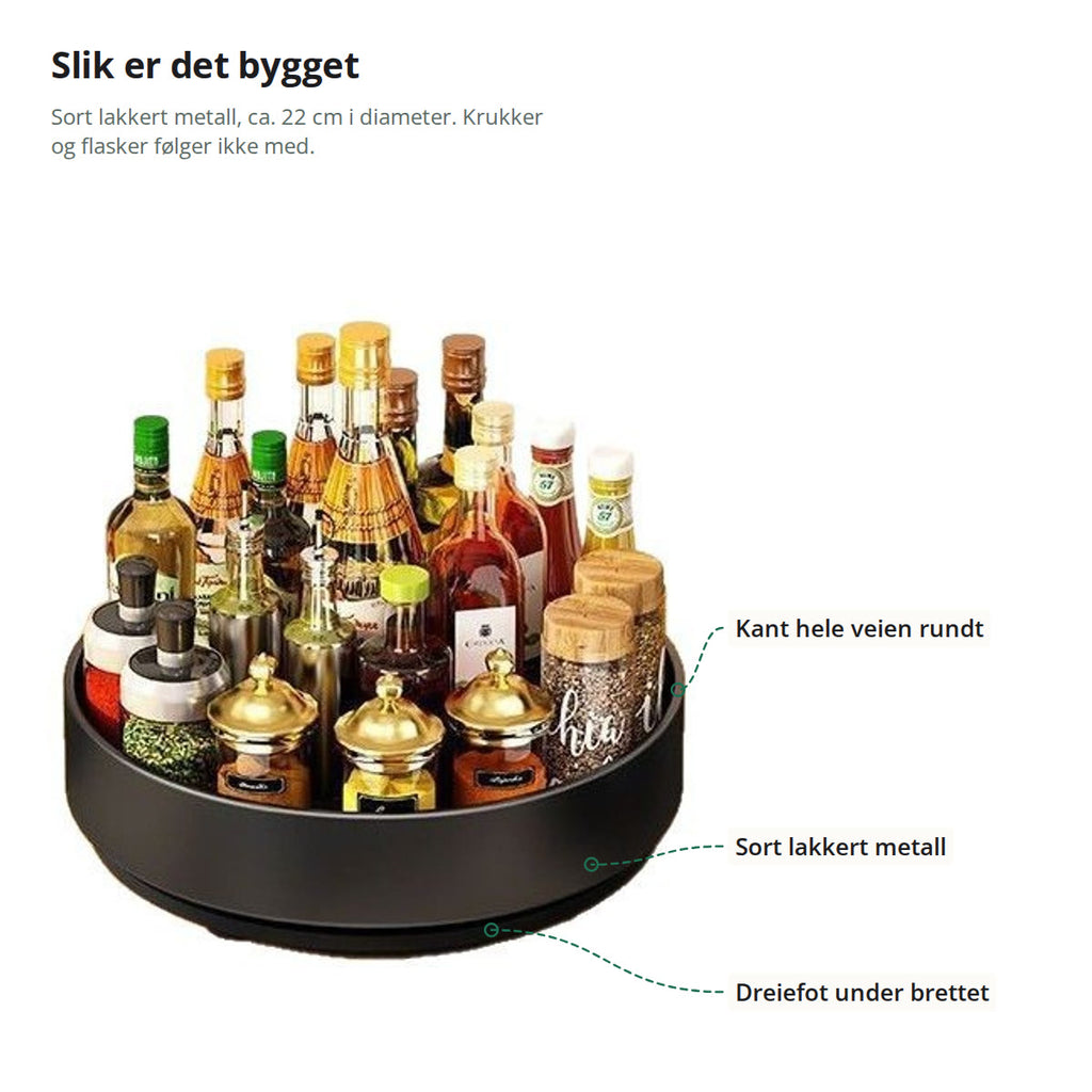 Snurrebrettet merket med kanten hele veien rundt, det sort lakkerte metallet og dreiefoten under brettet