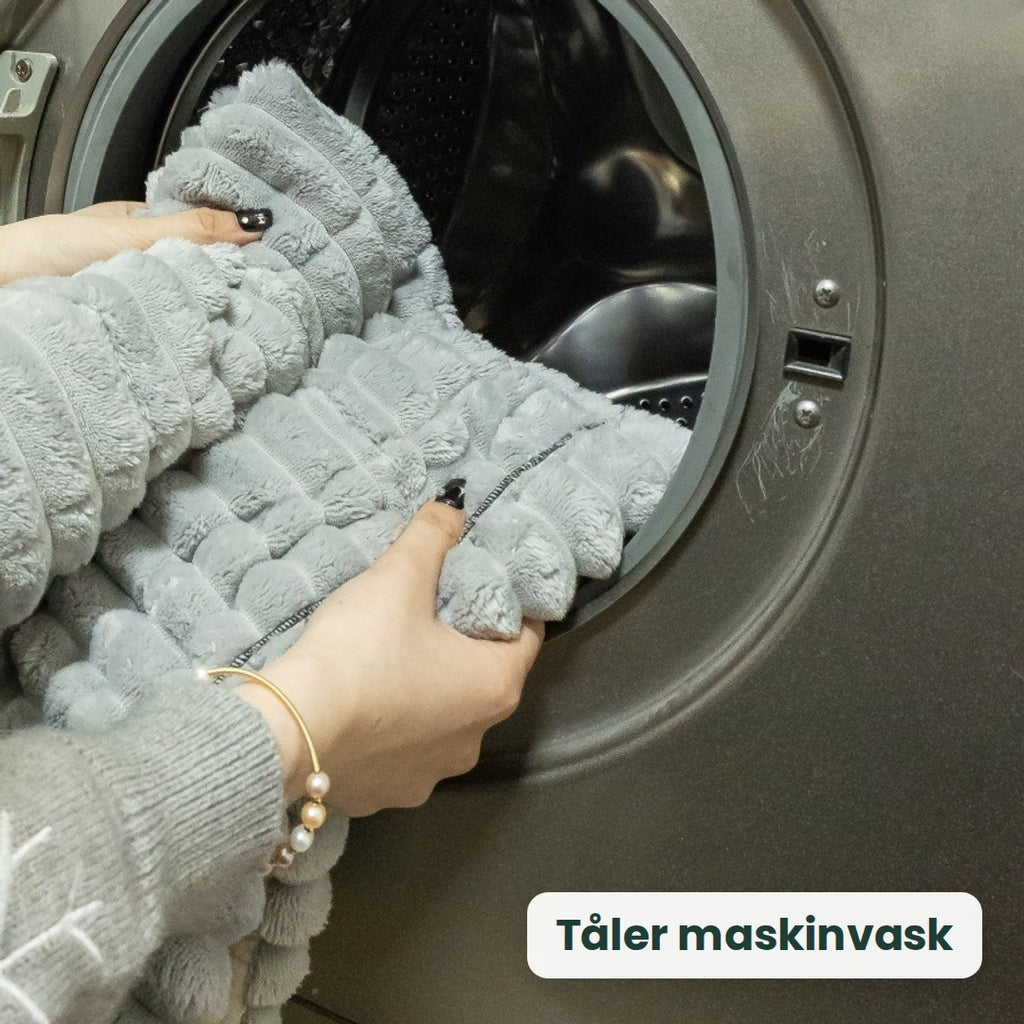 Kosla-trekket legges i vaskemaskinen