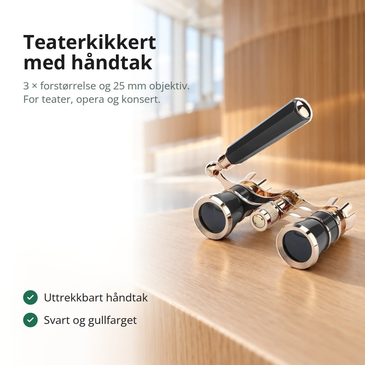 Svart teaterkikkert med gullfargede detaljer og utfelt håndtak, på en kant i lys eik i et lyst foajé med store vinduer