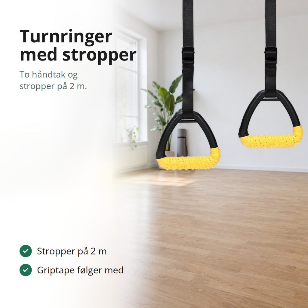 Turnringer med trekantede håndtak og gul griptape som henger i svarte stropper i en lys stue