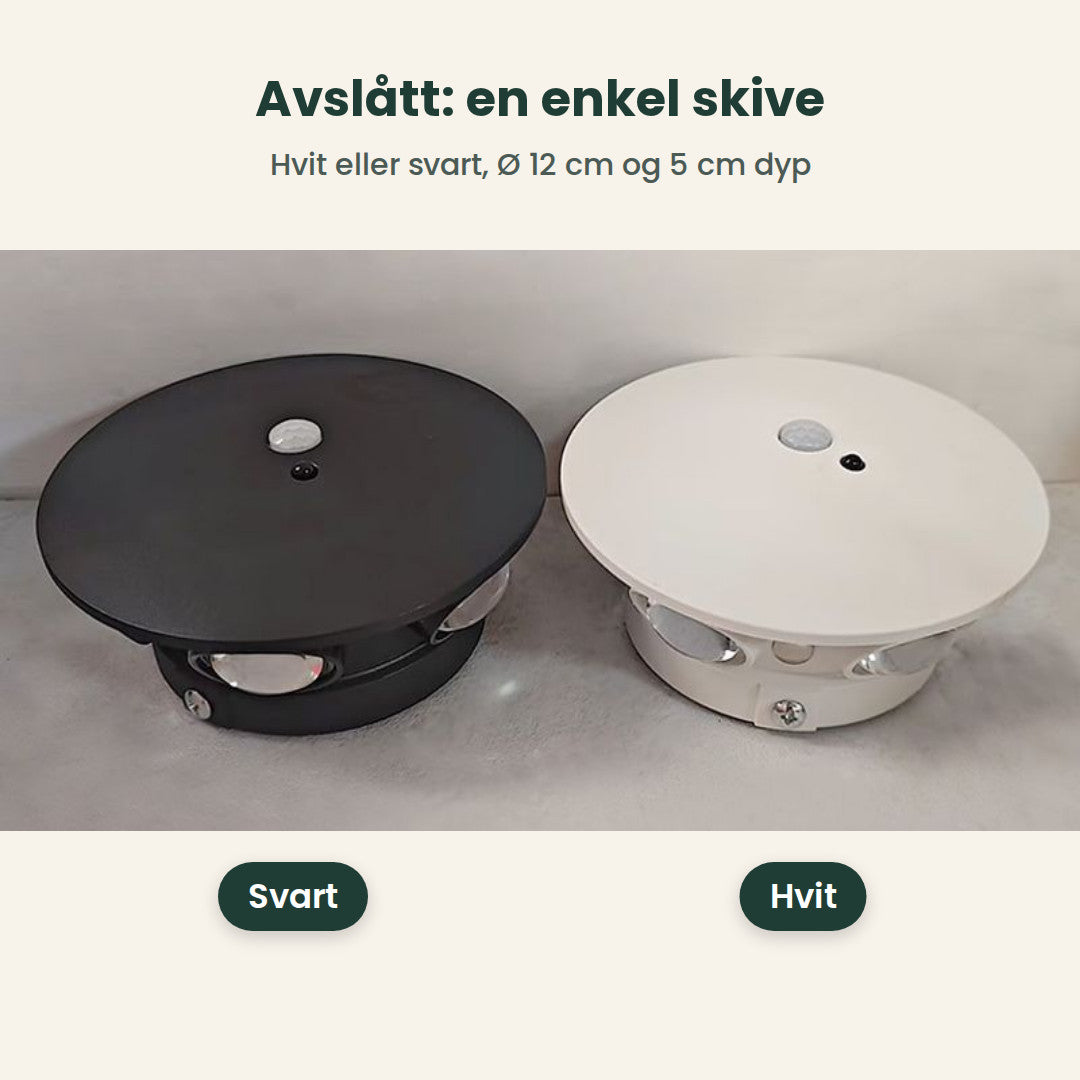 Svart og hvit lampe avslått på et bord, Ø 12 cm og 5 cm dype
