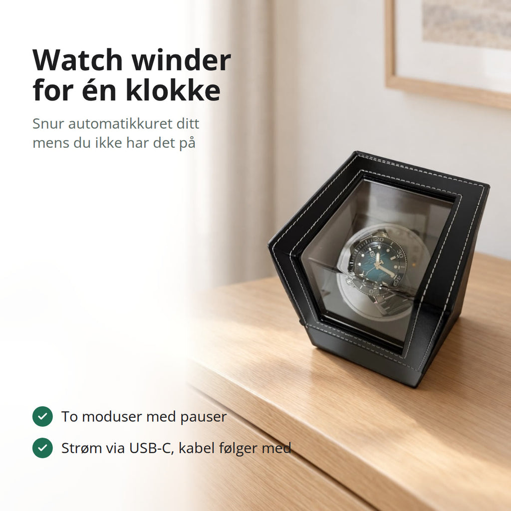 Watch winder for én klokke i svart kunstskinn med hvite sømmer og vindu i lokket, på en kommode i lys eik i et lyst soverom